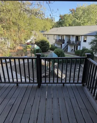 a view of a house with potted plants