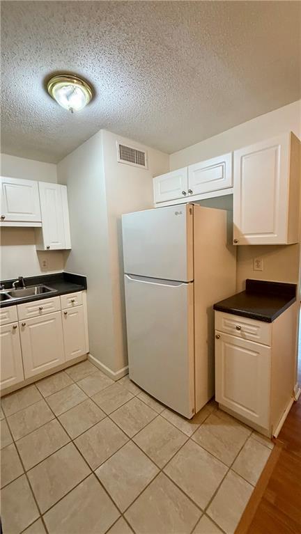 3595 Woodbriar Circle, Unit N Tucker, GA 30084 - Photo 10 of 39 a kitchen with cabinets and a stove top oven