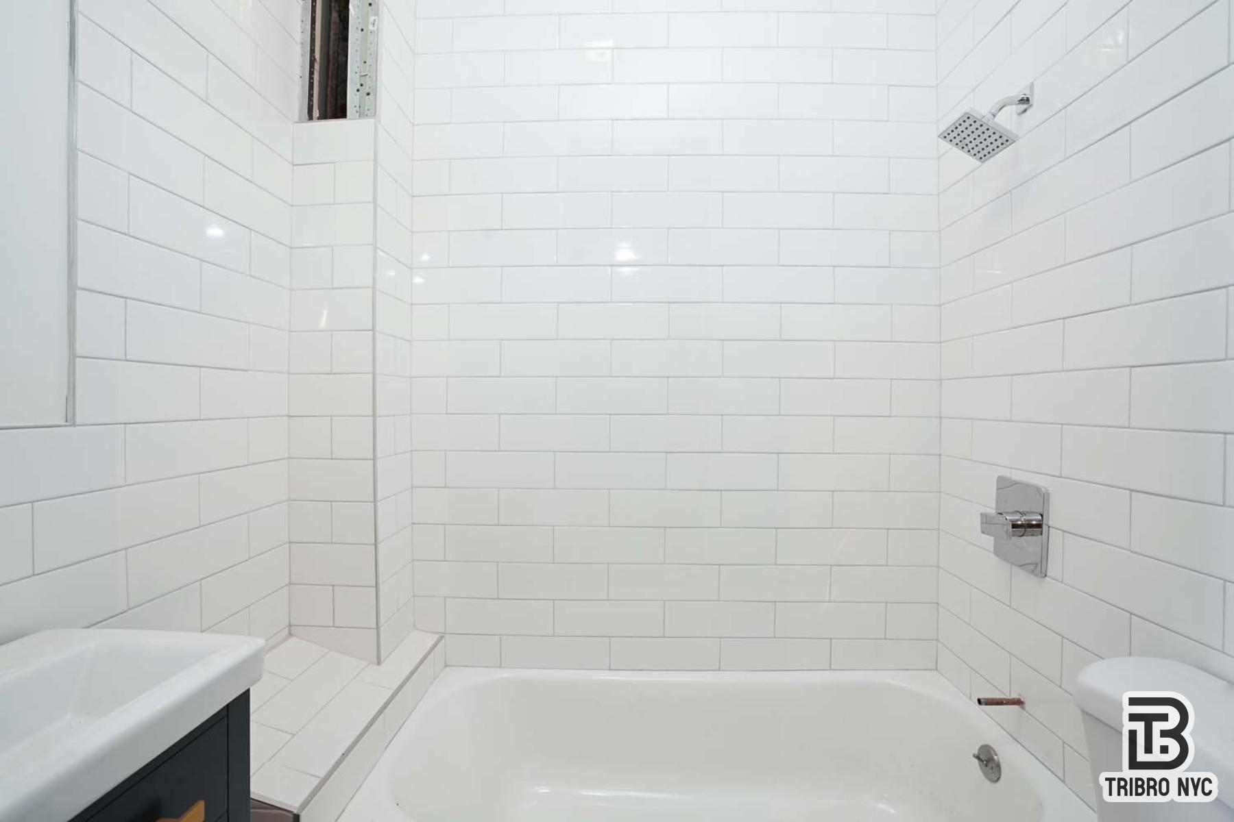 60-42 Grove Street, Unit 2R Queens, NY 11385 - Photo 7 of 7 a close up of a bathtub