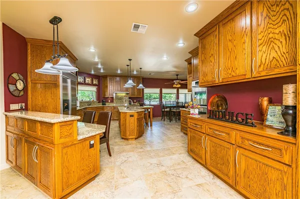 a kitchen with stainless steel appliances granite countertop counter space a sink and cabinets