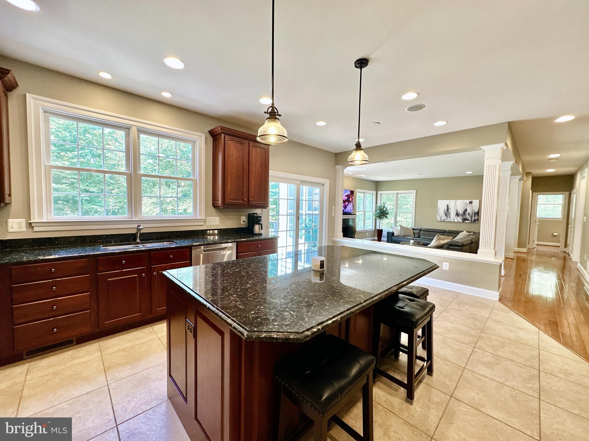 513 Broad Stream Lane Riva, MD 21140 - Photo 18 of 67 a kitchen with stainless steel appliances granite countertop counter space a sink and a refrigerator