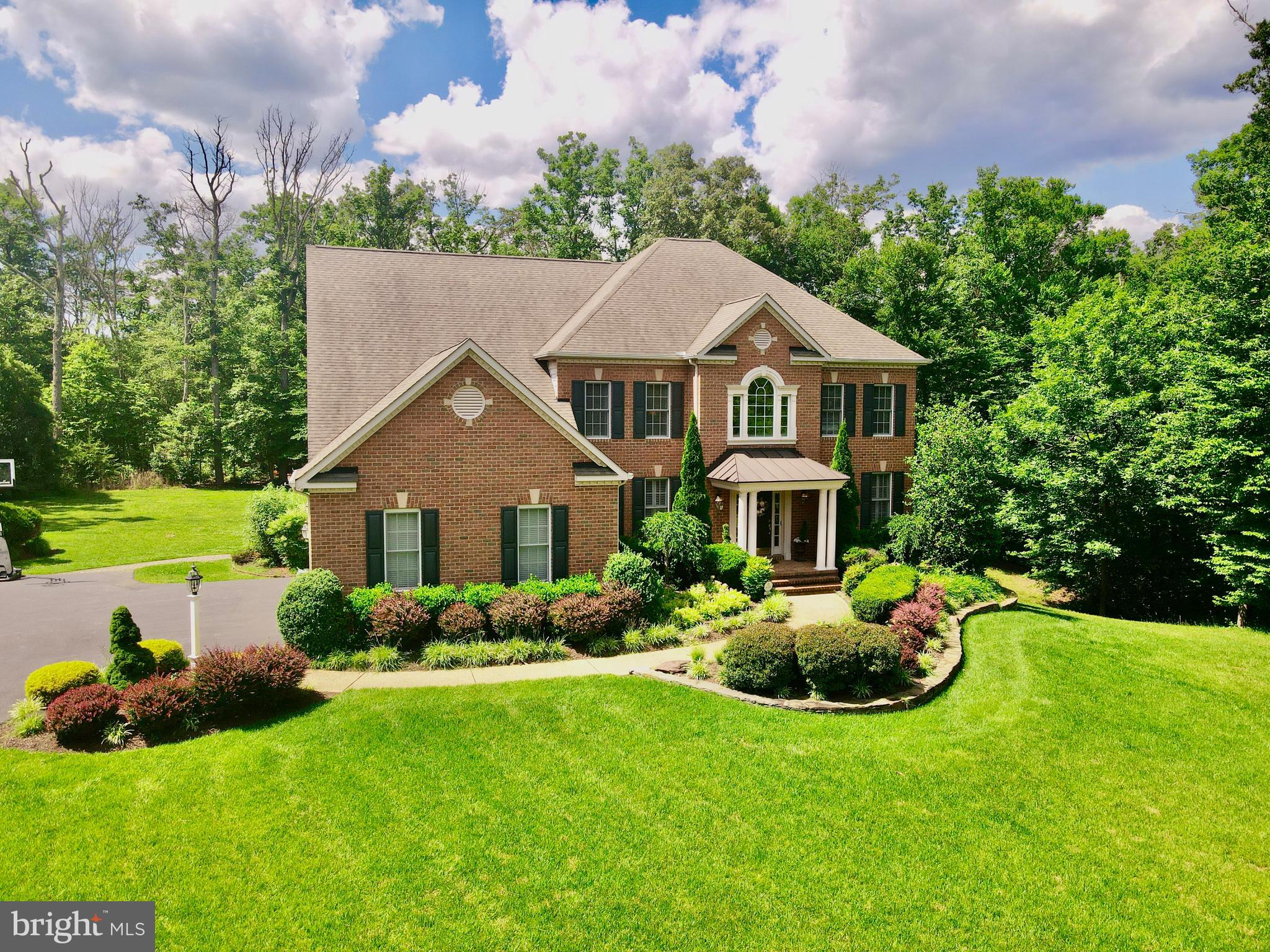 513 Broad Stream Lane Riva, MD 21140 - Photo 2 of 67 a front view of a house with garden