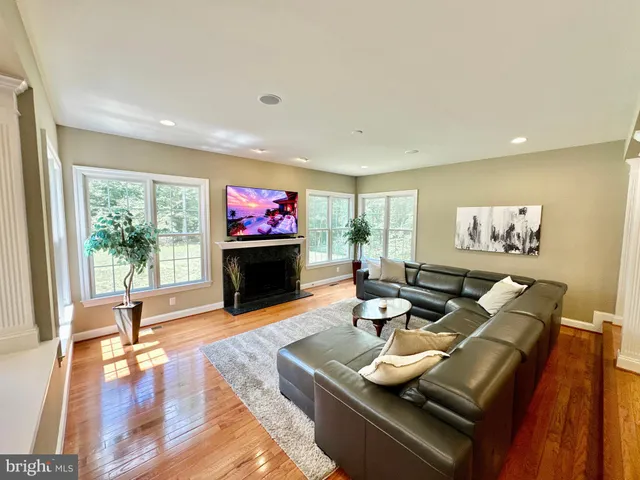a bathroom with a sink mirror and toilet