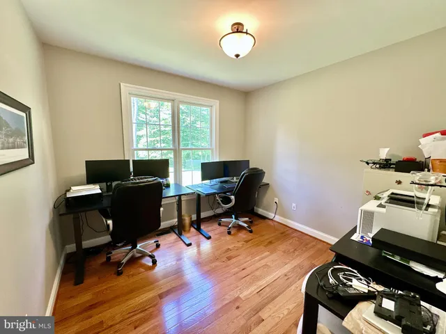 a bathroom with a bathtub and next to a window