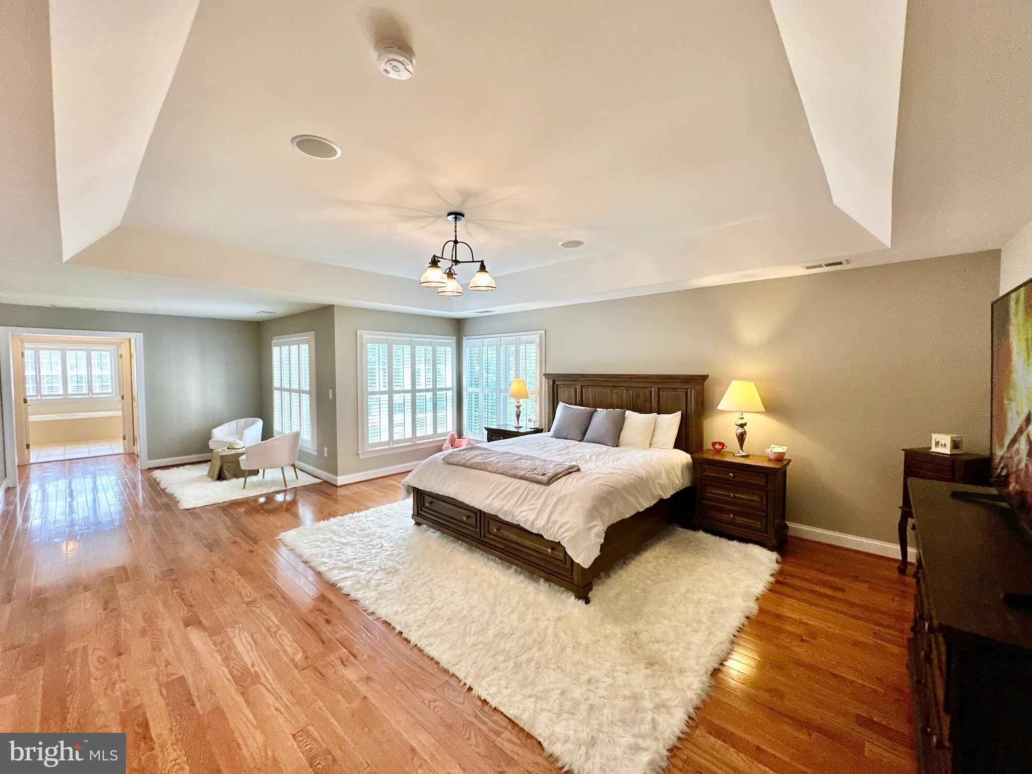 513 Broad Stream Lane Riva, MD 21140 - Photo 35 of 67 a spacious bedroom with a bed and wooden floor