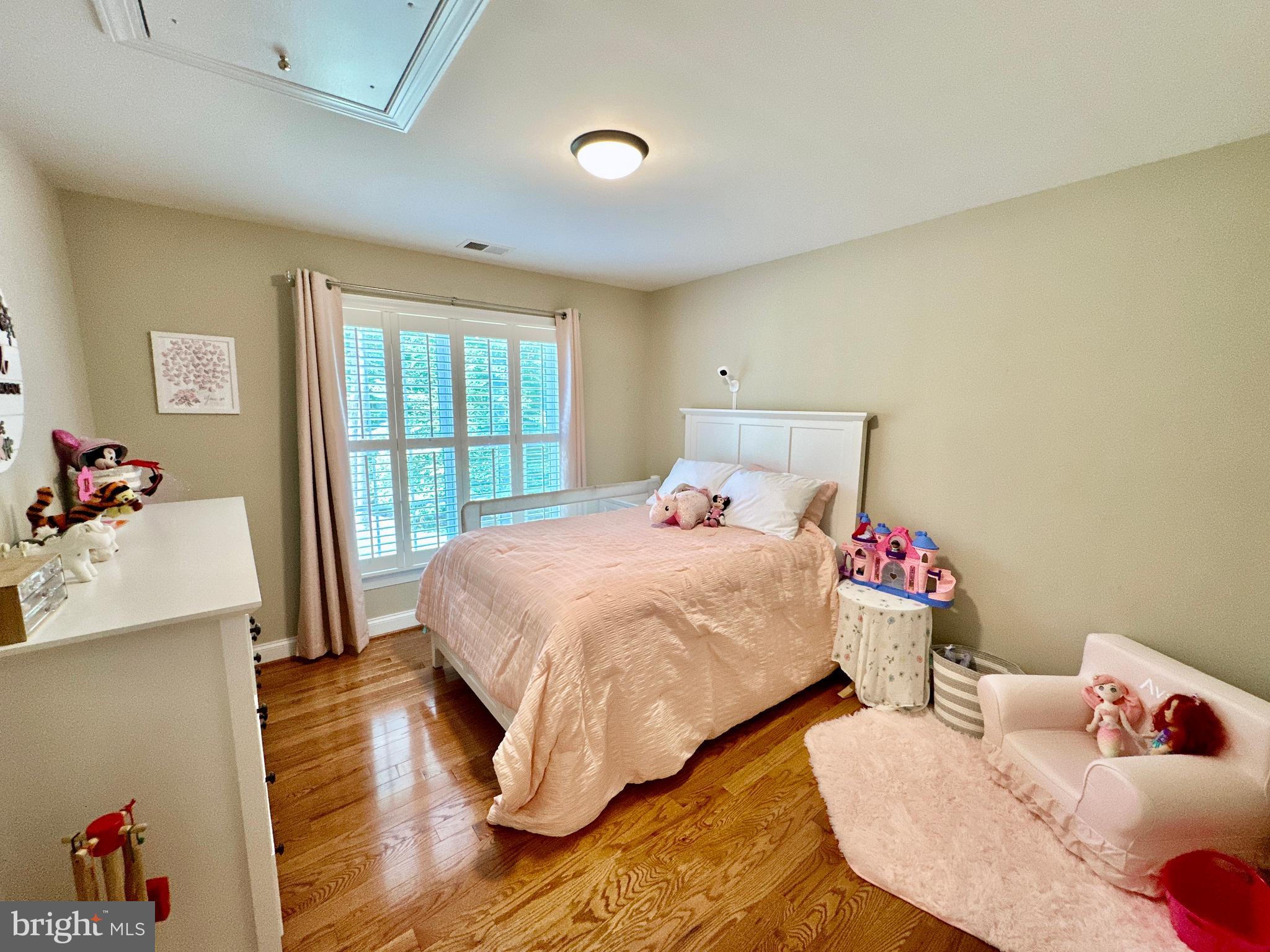 513 Broad Stream Lane Riva, MD 21140 - Photo 43 of 67 a bedroom with a bed and wooden floor