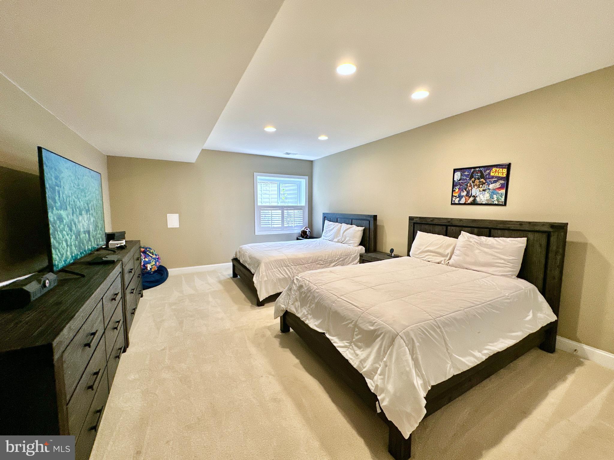 513 Broad Stream Lane Riva, MD 21140 - Photo 56 of 67 a bedroom with two bed and a flat screen tv