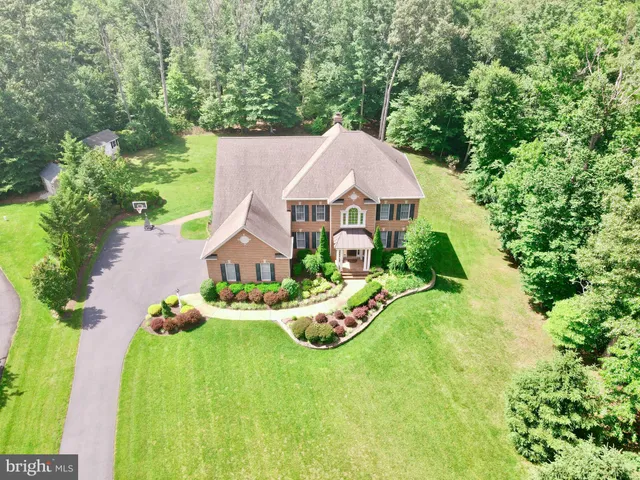 a work room with furniture wooden floor and a window