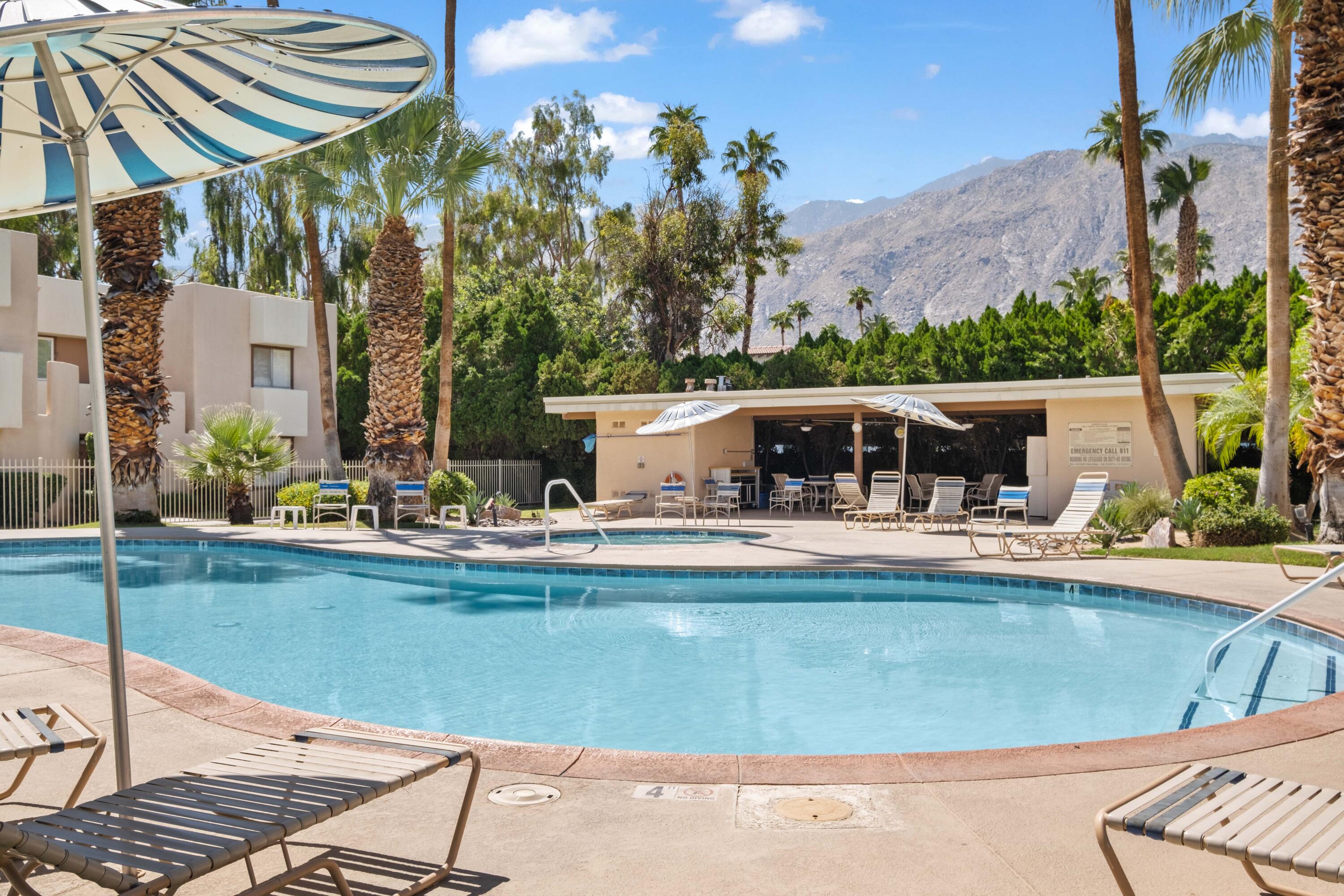 1268 Ramon Road, Unit 61 Palm Springs, CA 92264 - Photo 16 of 18 a view of a swimming pool with a patio