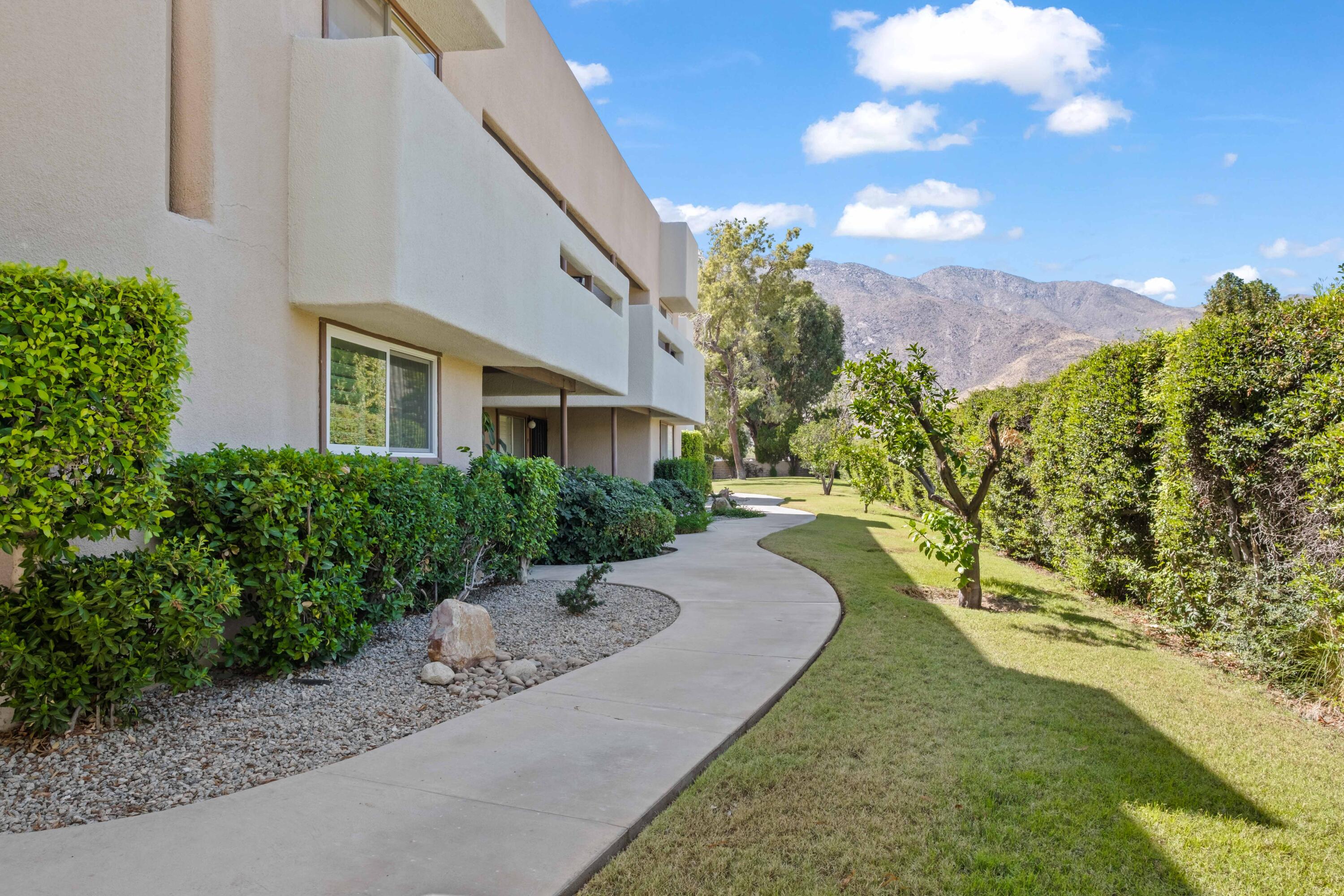 1268 Ramon Road, Unit 61 Palm Springs, CA 92264 - Photo 2 of 18 a view of a front of house with a yard