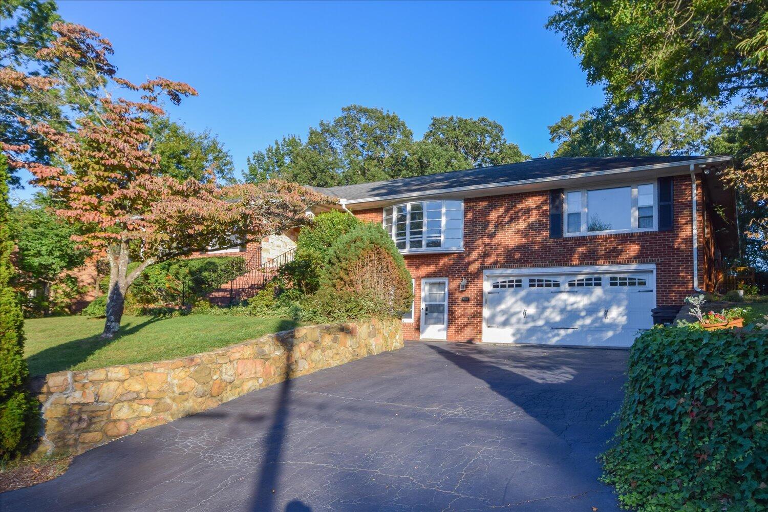 3060 Sedgefield Road Southwest Roanoke, VA 24018 - Photo 1 of 39 a front view of a house with a yard