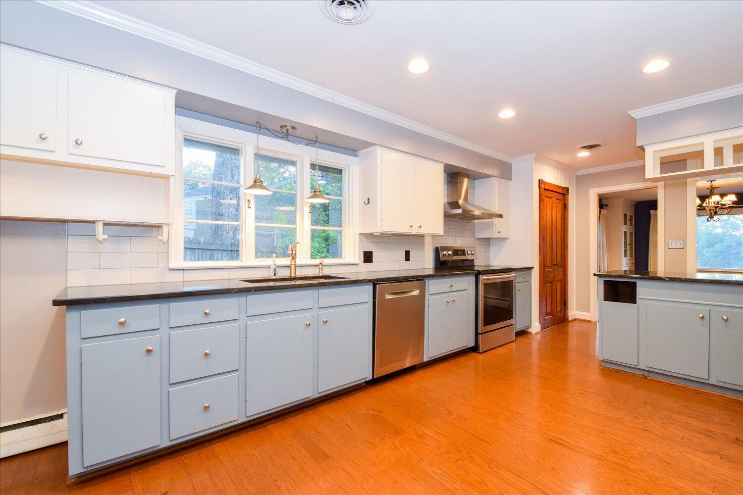 3060 Sedgefield Road Southwest Roanoke, VA 24018 - Photo 11 of 39 a large kitchen with granite countertop a stove a sink and a refrigerator