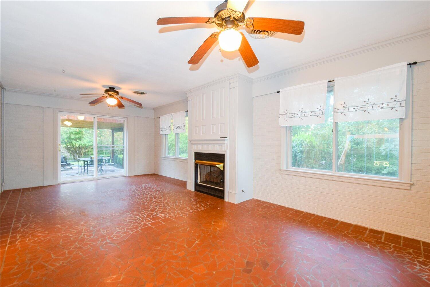 3060 Sedgefield Road Southwest Roanoke, VA 24018 - Photo 13 of 39 an empty room with windows and fireplace