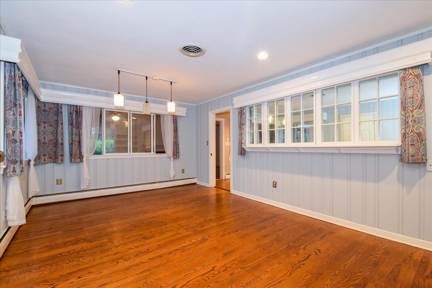 3060 Sedgefield Road Southwest Roanoke, VA 24018 - Photo 15 of 39 a view of an empty room with wooden floor and a window