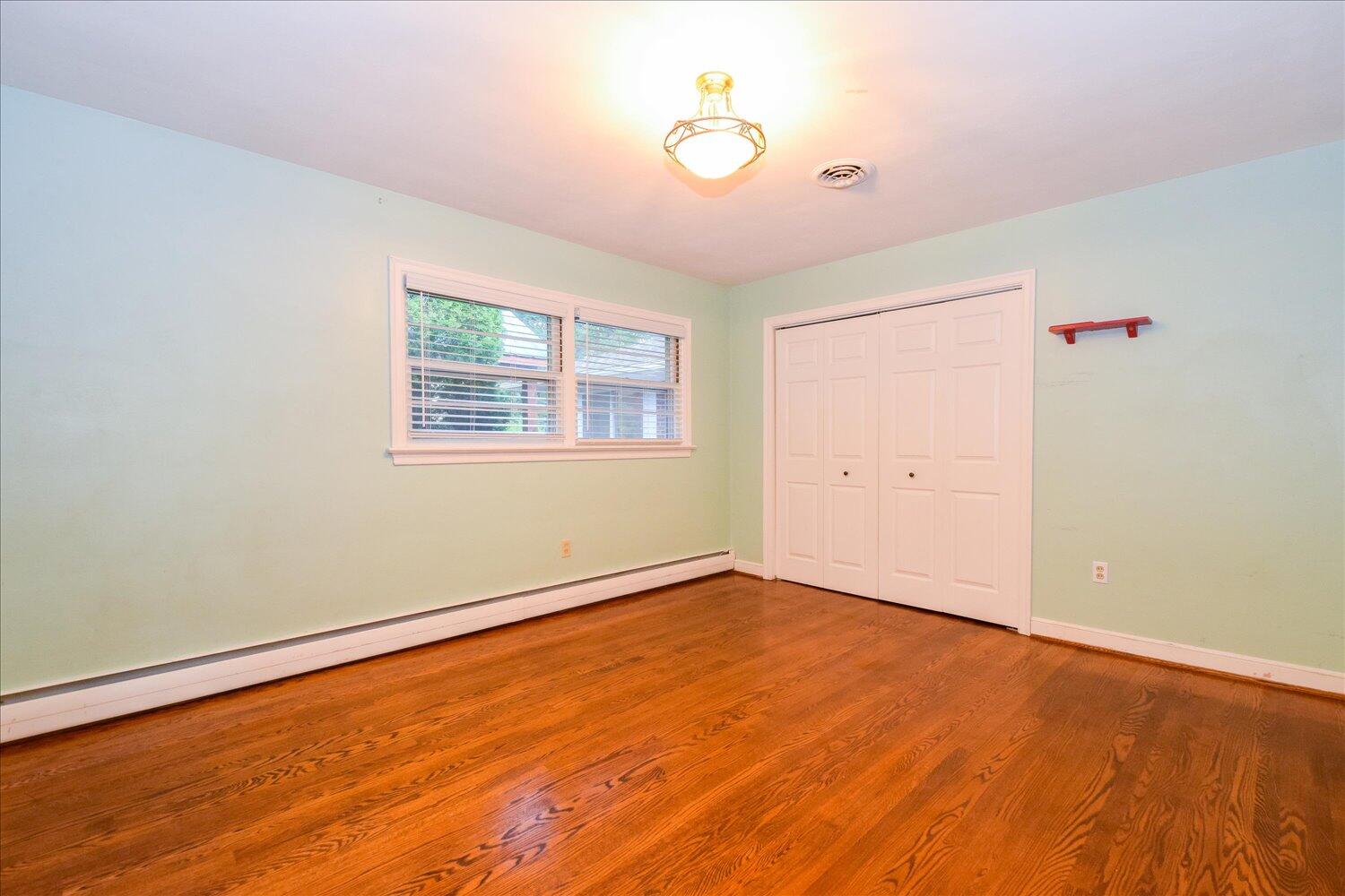 3060 Sedgefield Road Southwest Roanoke, VA 24018 - Photo 17 of 39 wooden floor in an empty room with a window