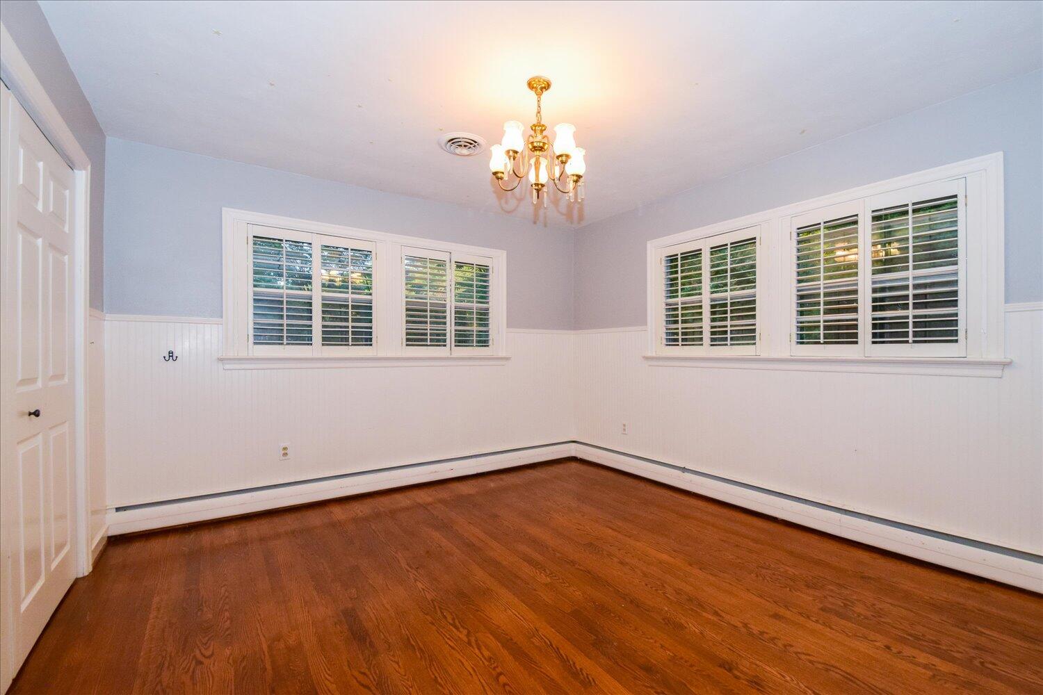 3060 Sedgefield Road Southwest Roanoke, VA 24018 - Photo 19 of 39 wooden floor in an empty room with a window