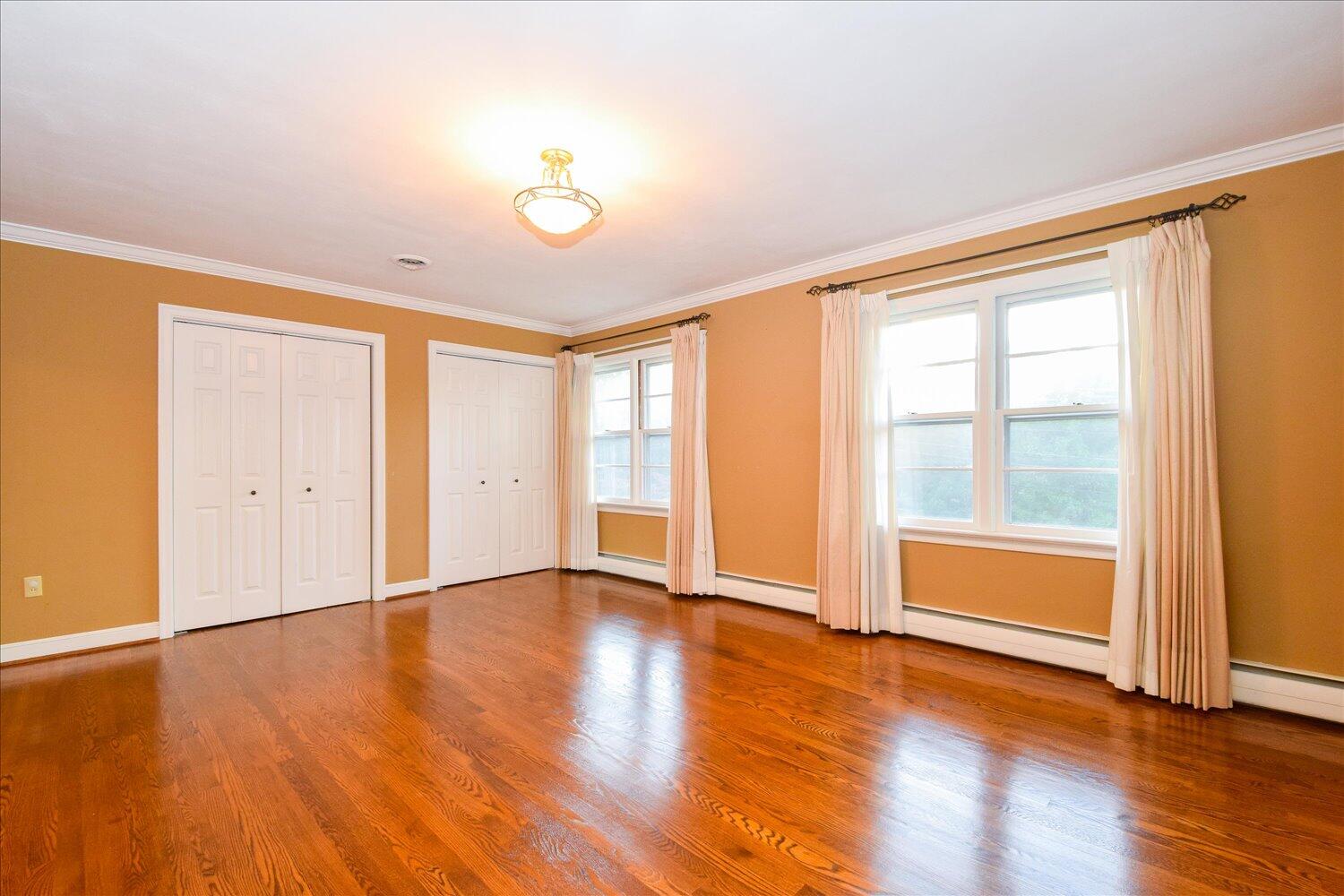 3060 Sedgefield Road Southwest Roanoke, VA 24018 - Photo 20 of 39 an empty room with wooden floor and windows