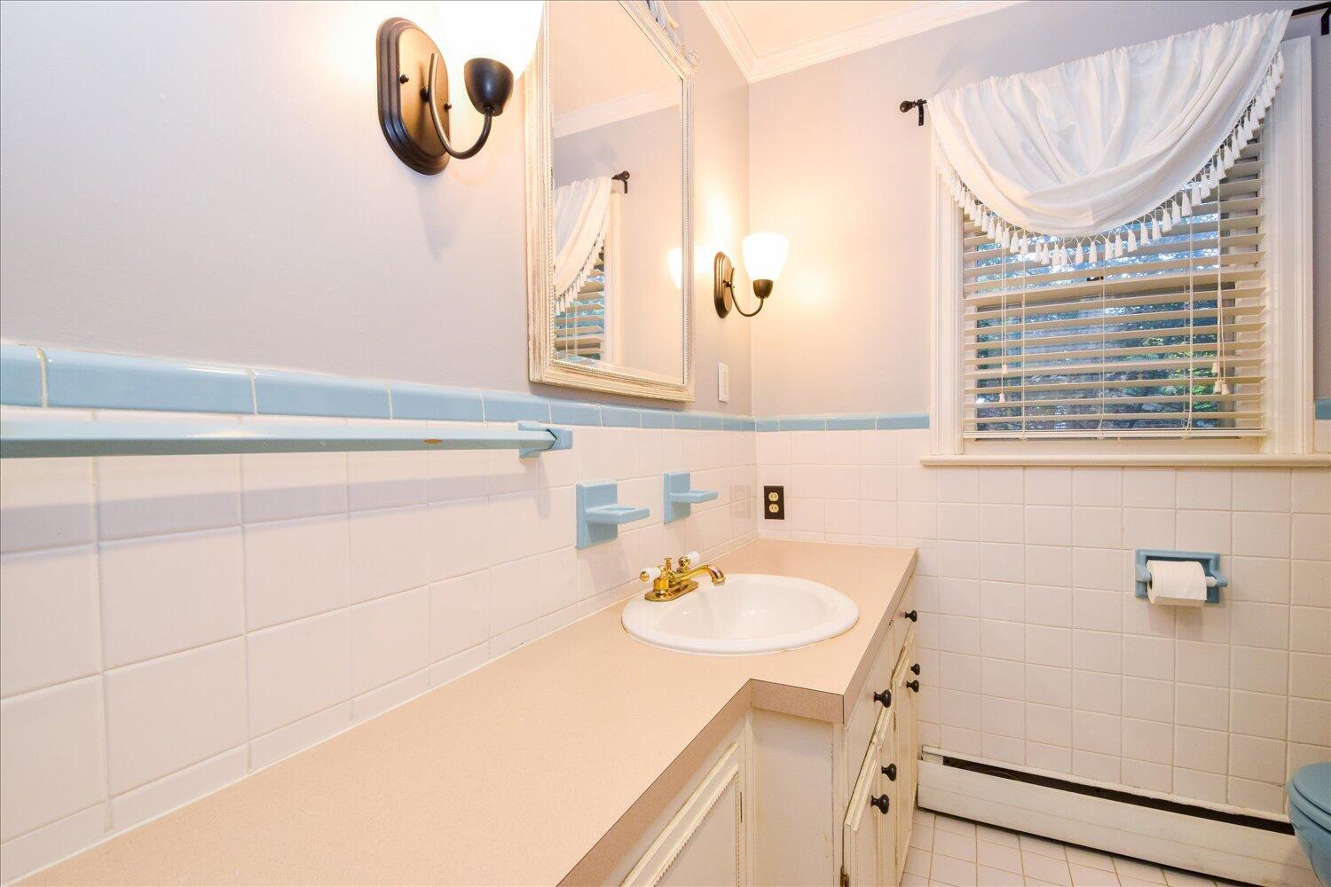 3060 Sedgefield Road Southwest Roanoke, VA 24018 - Photo 21 of 39 a bathroom with a sink and a mirror