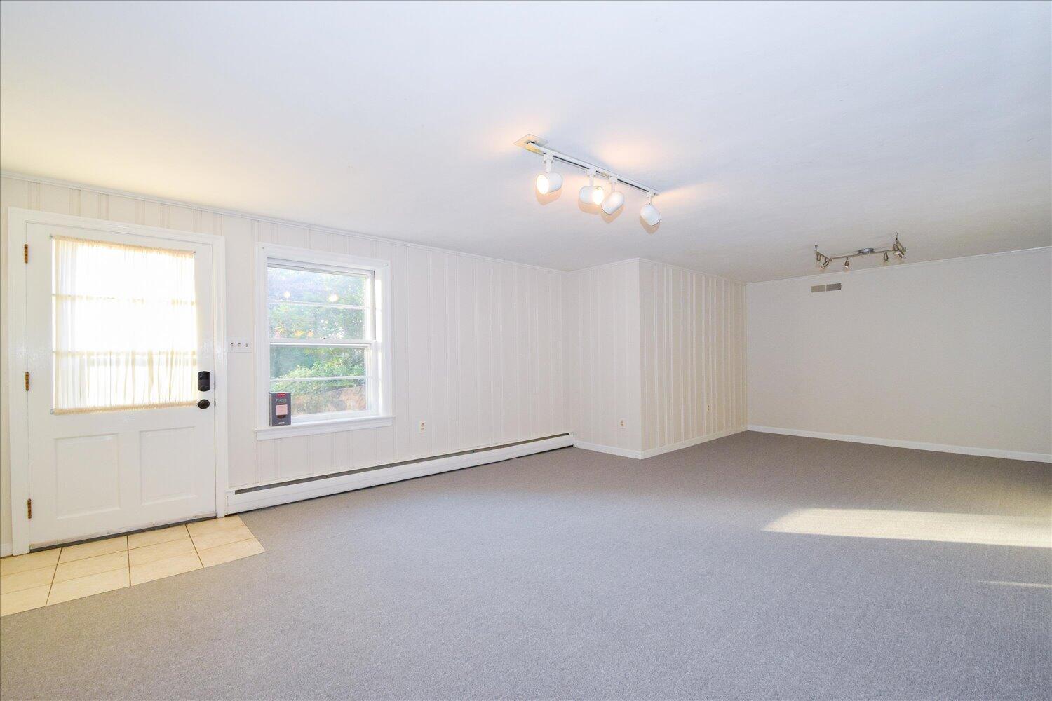 3060 Sedgefield Road Southwest Roanoke, VA 24018 - Photo 22 of 39 an empty room with a empty space and windows