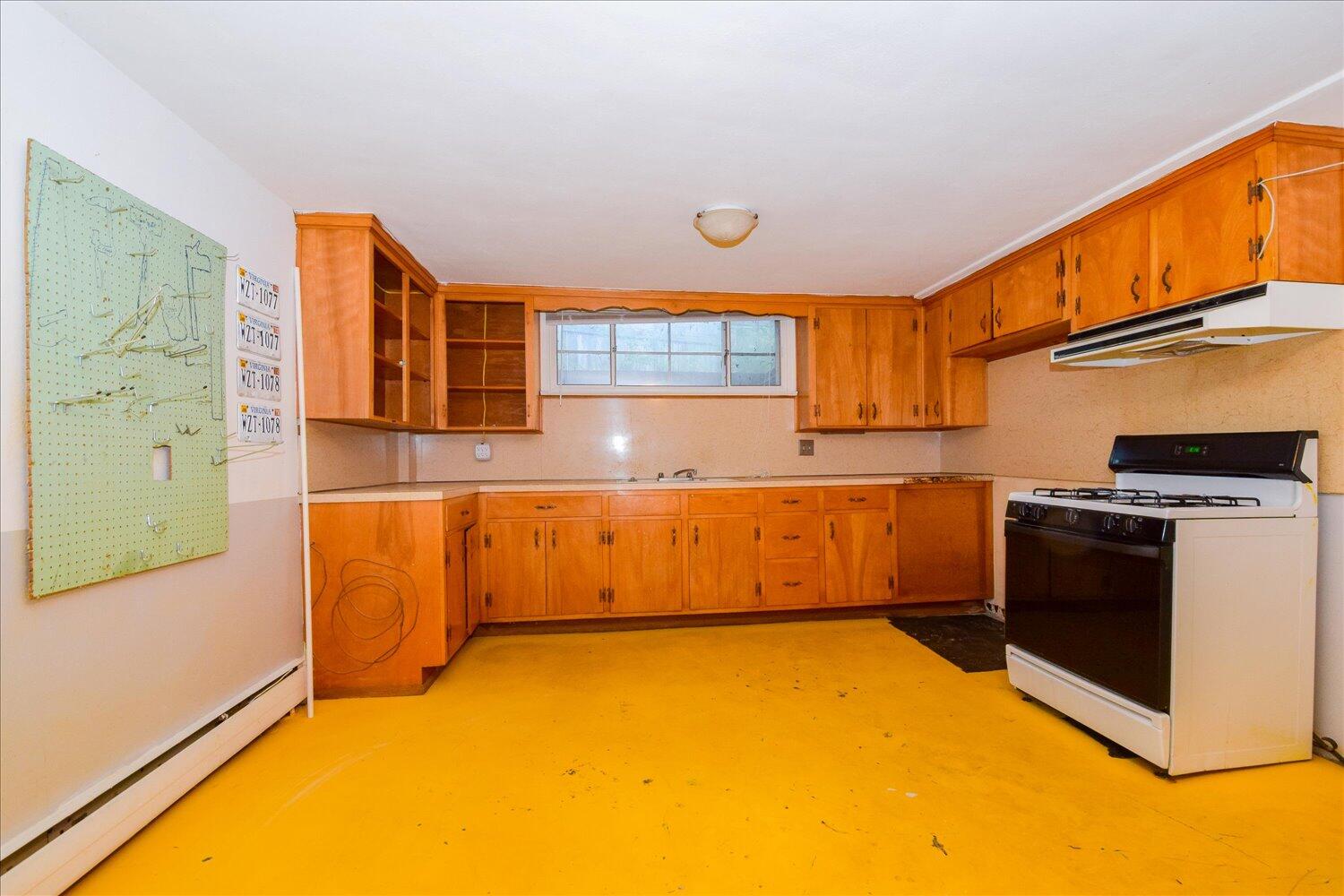 3060 Sedgefield Road Southwest Roanoke, VA 24018 - Photo 23 of 39 a kitchen with stainless steel appliances granite countertop a stove a sink and a microwave