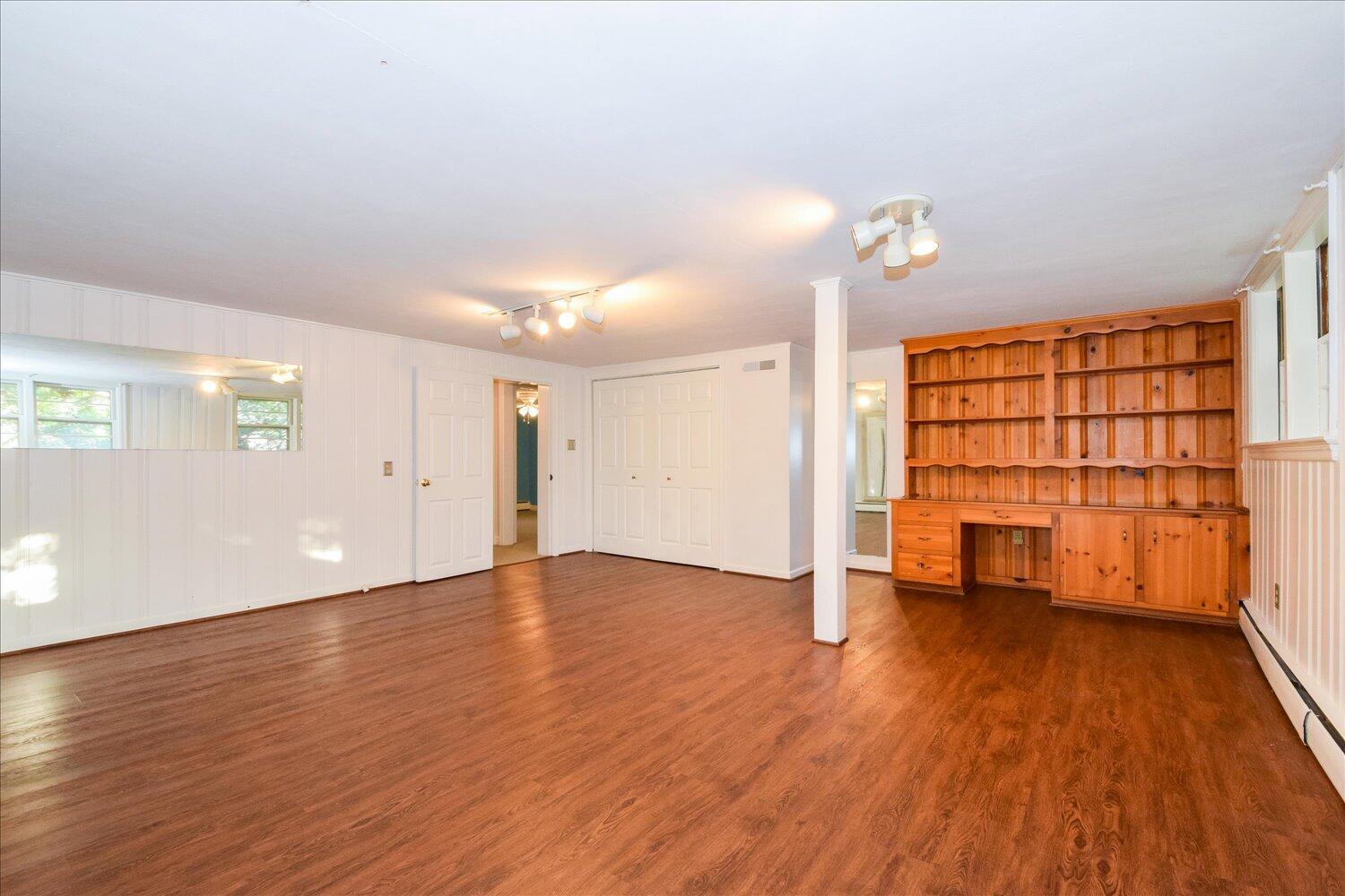 3060 Sedgefield Road Southwest Roanoke, VA 24018 - Photo 26 of 39 an empty room with wooden floor and windows