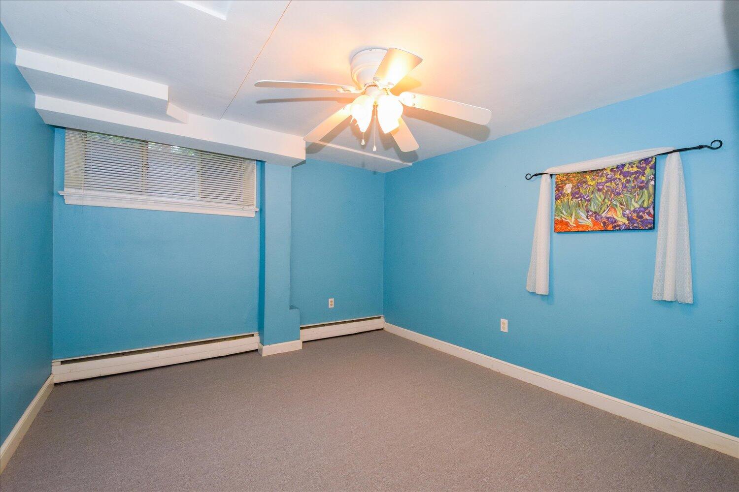 3060 Sedgefield Road Southwest Roanoke, VA 24018 - Photo 27 of 39 an empty room with a fan & a window