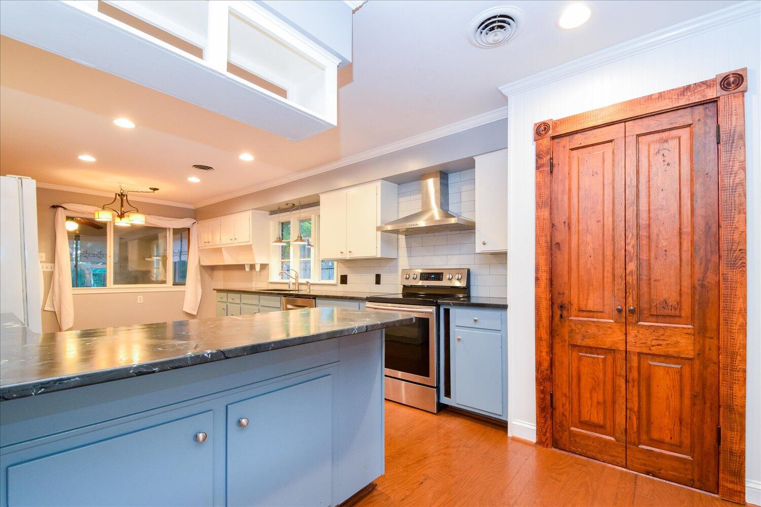 3060 Sedgefield Road Southwest Roanoke, VA 24018 - Photo 9 of 39 a kitchen with stainless steel appliances granite countertop wooden cabinets and a refrigerator