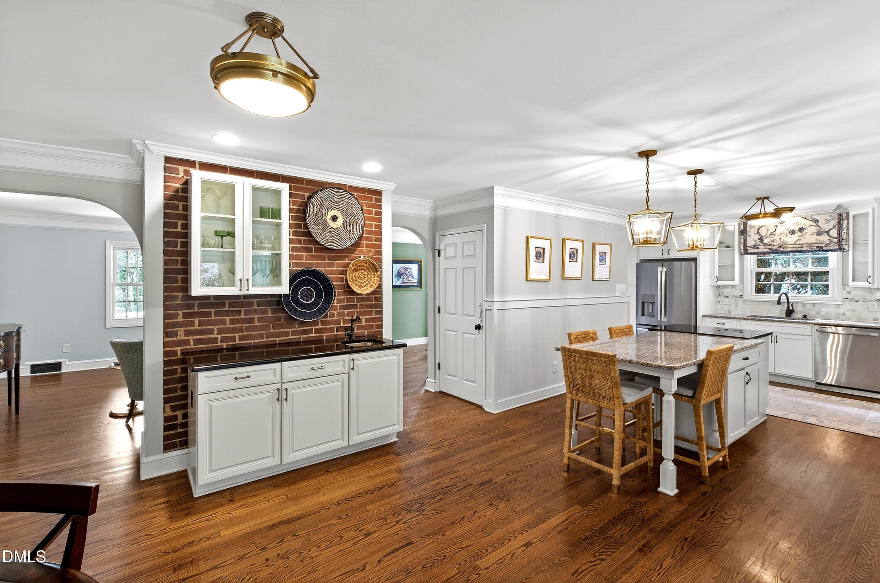 1205 Canterbury Road Raleigh, NC 27608 - Photo 10 of 48 a kitchen with a dining table chairs and wooden floor