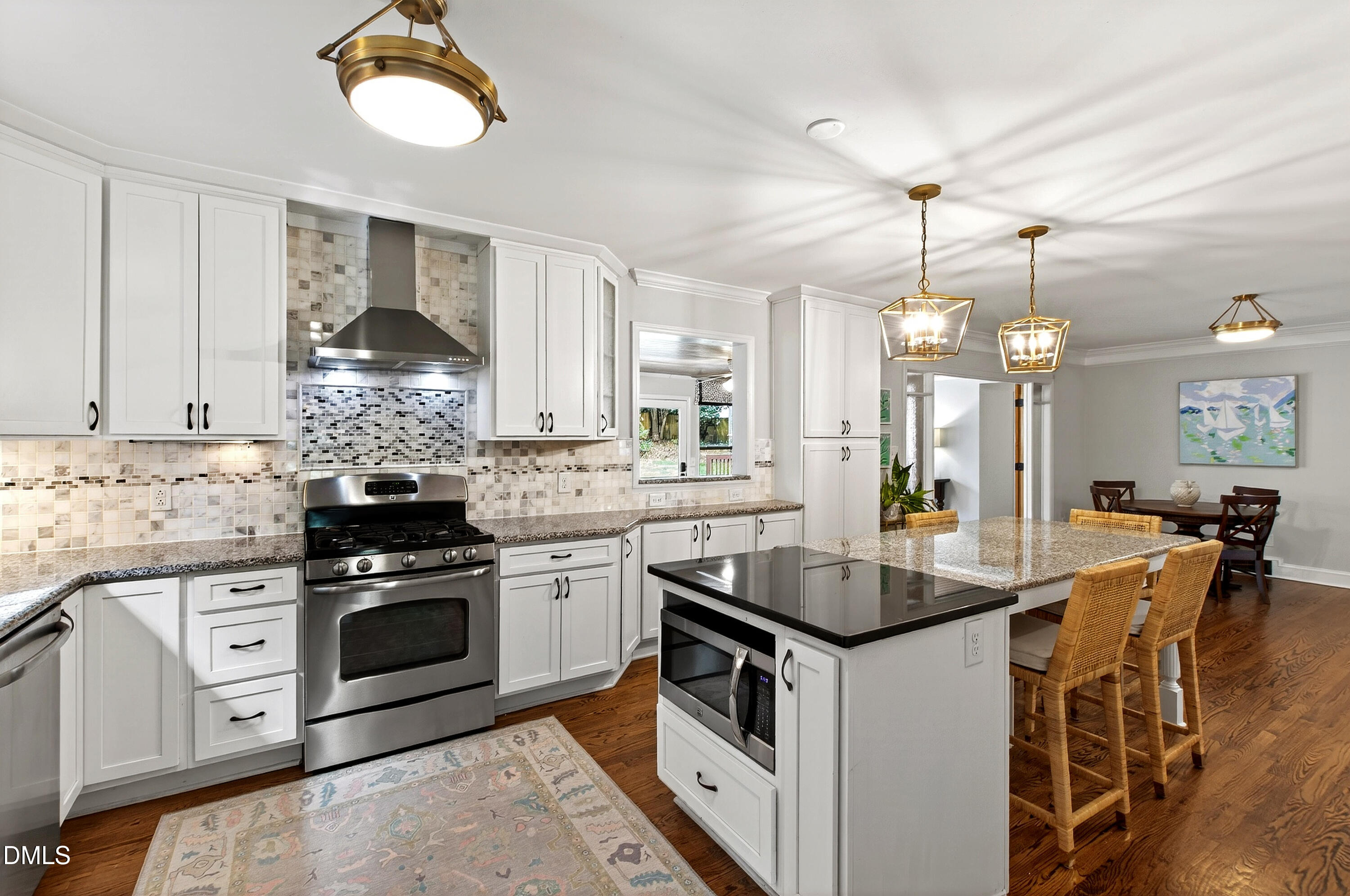 1205 Canterbury Road Raleigh, NC 27608 - Photo 13 of 48 a kitchen with granite countertop a sink and a stove