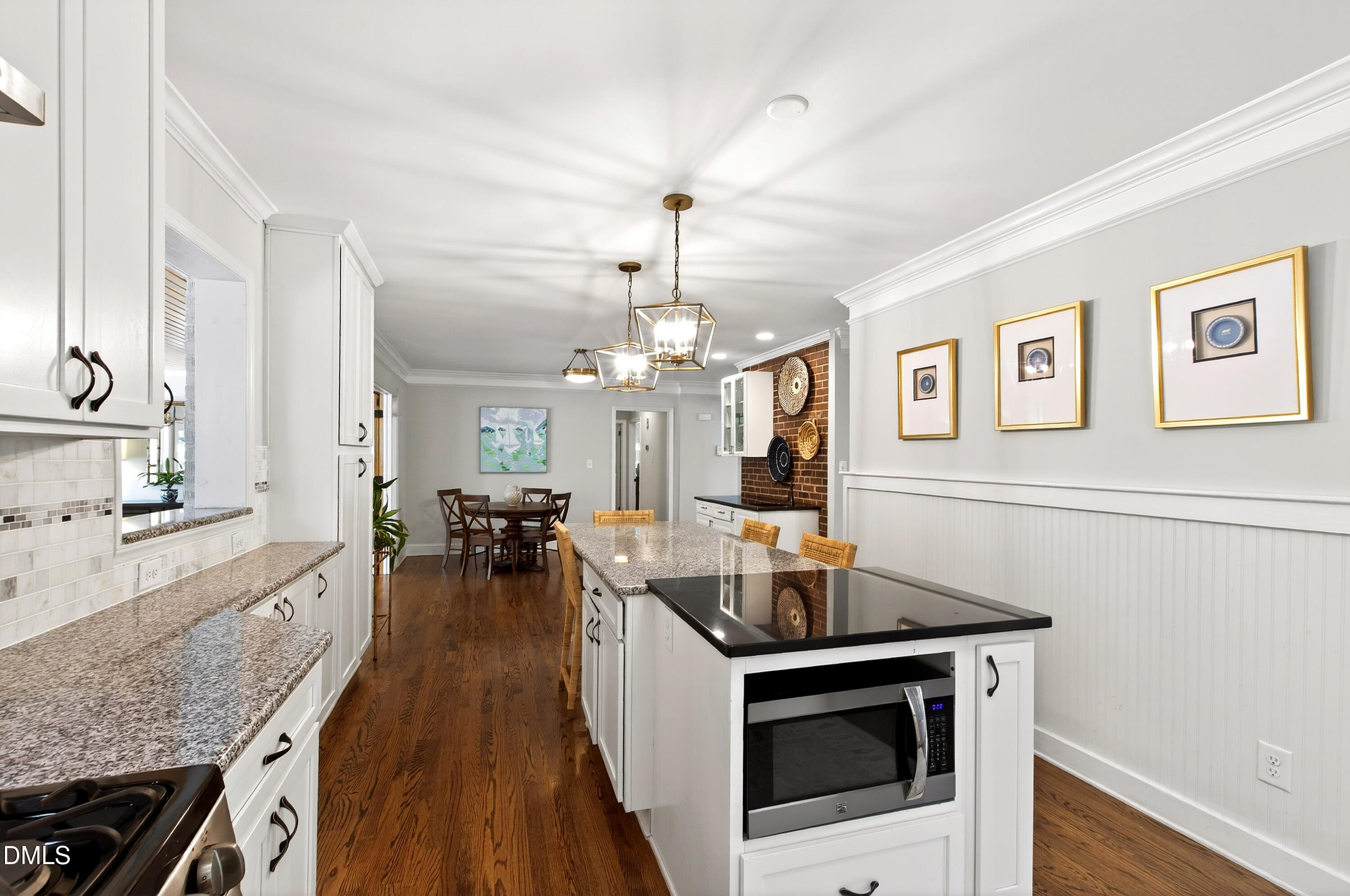 1205 Canterbury Road Raleigh, NC 27608 - Photo 16 of 48 a kitchen with sink stove and cabinets