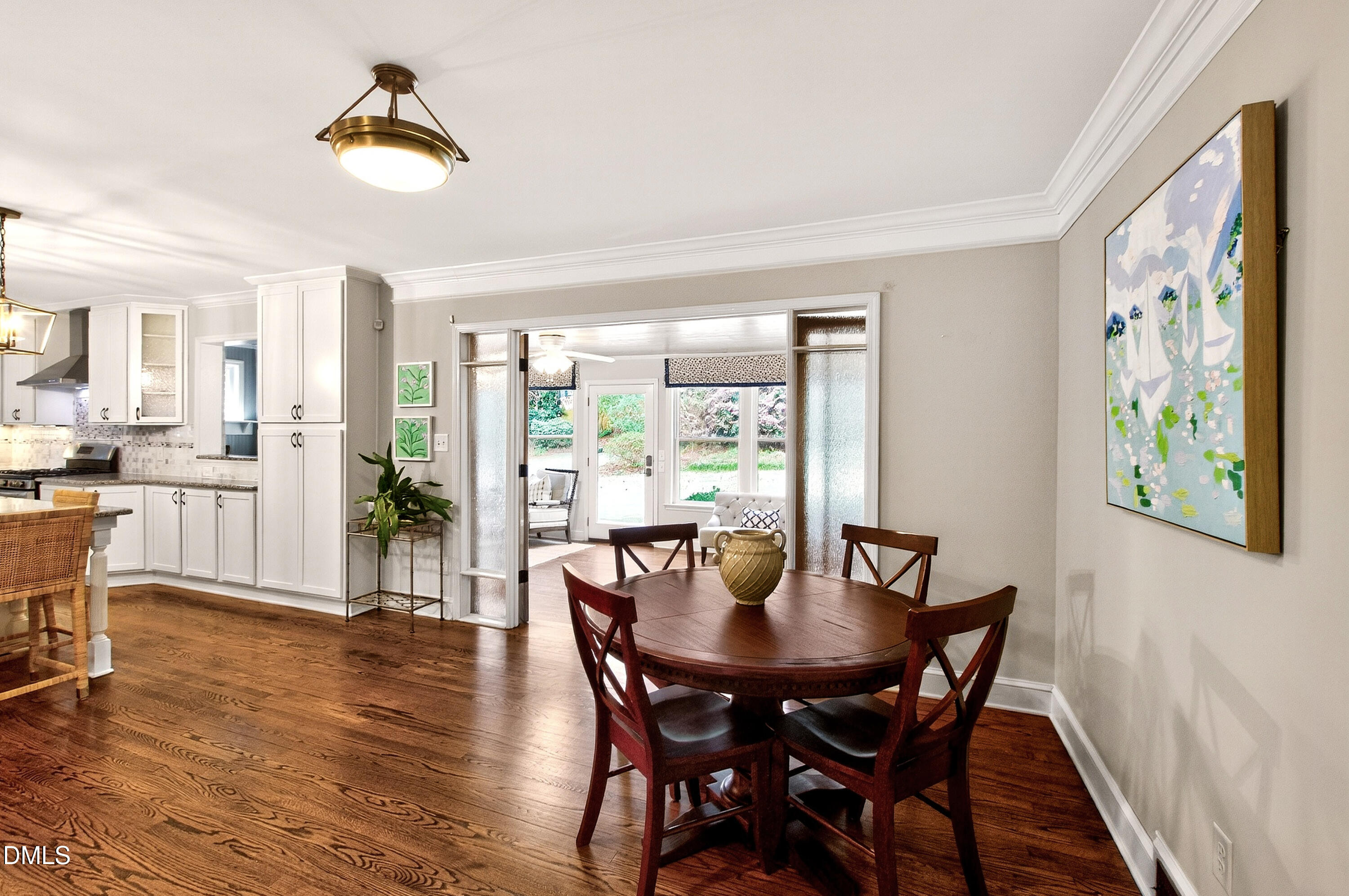 1205 Canterbury Road Raleigh, NC 27608 - Photo 17 of 48 a view of a dining room with furniture window and wooden floor