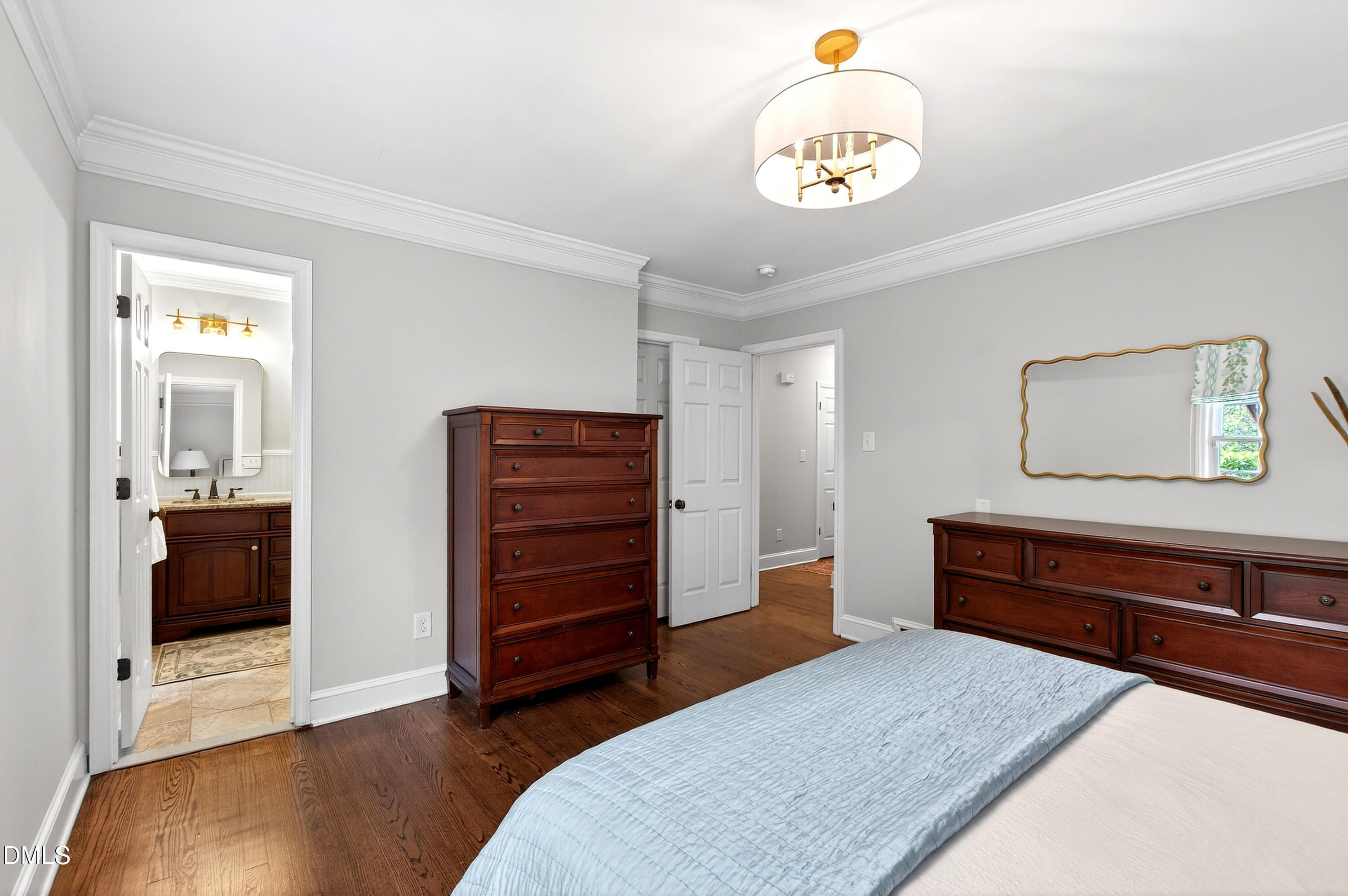 1205 Canterbury Road Raleigh, NC 27608 - Photo 23 of 48 a bedroom with a bed and a television