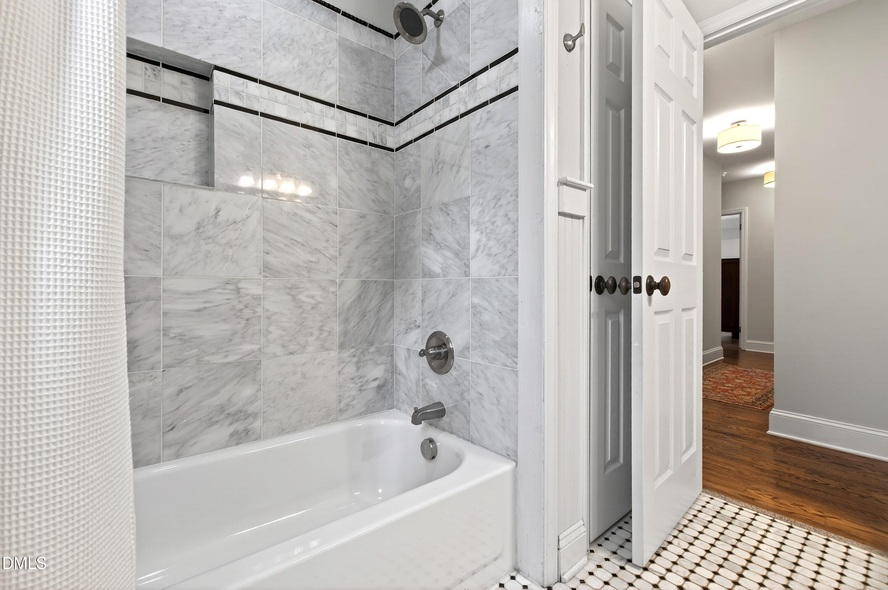 1205 Canterbury Road Raleigh, NC 27608 - Photo 31 of 48 a bathroom with a bathtub and a shower