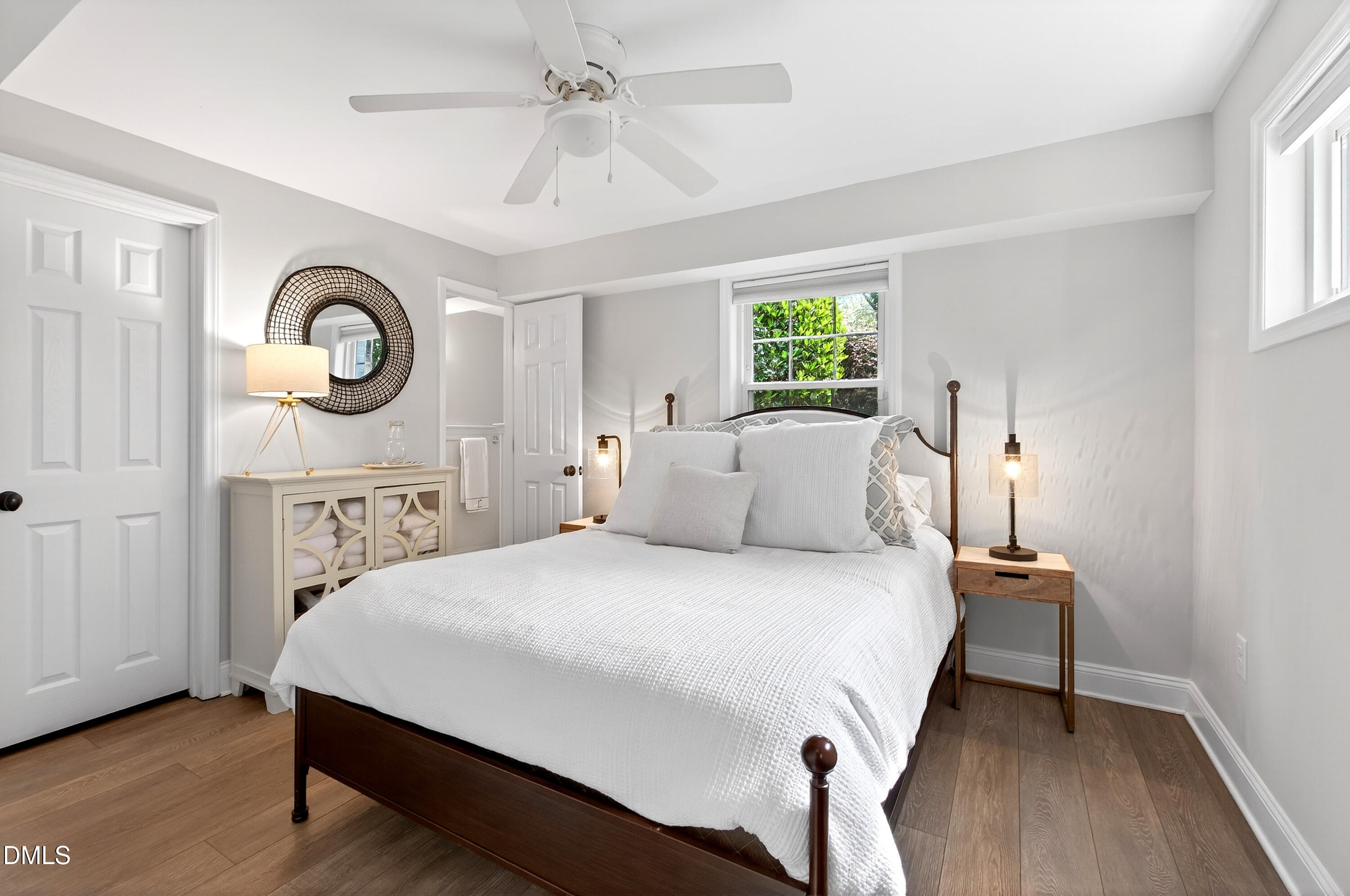 1205 Canterbury Road Raleigh, NC 27608 - Photo 36 of 48 a bedroom with a bed and a table