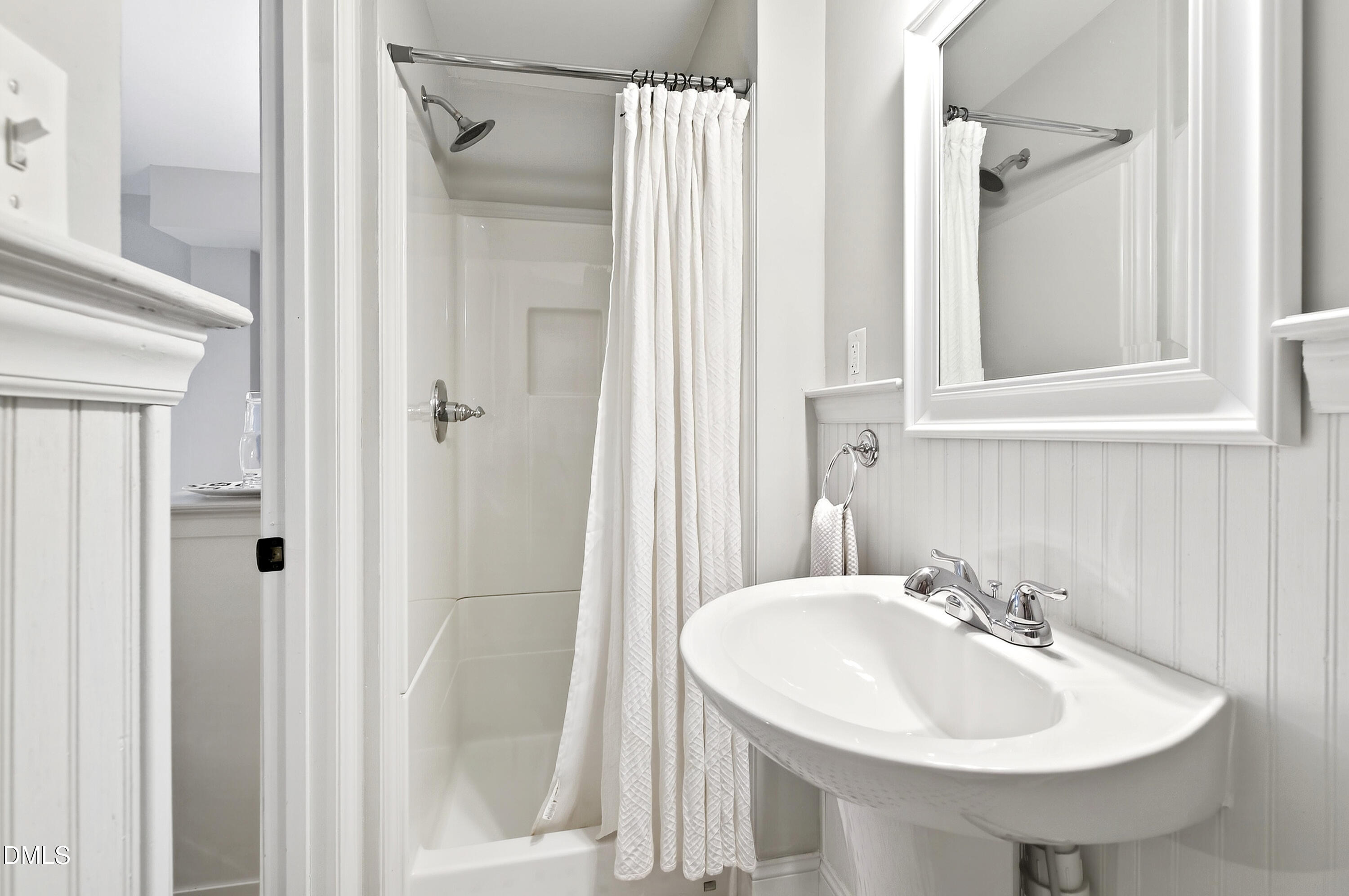 1205 Canterbury Road Raleigh, NC 27608 - Photo 38 of 48 a bathroom with a sink and a mirror