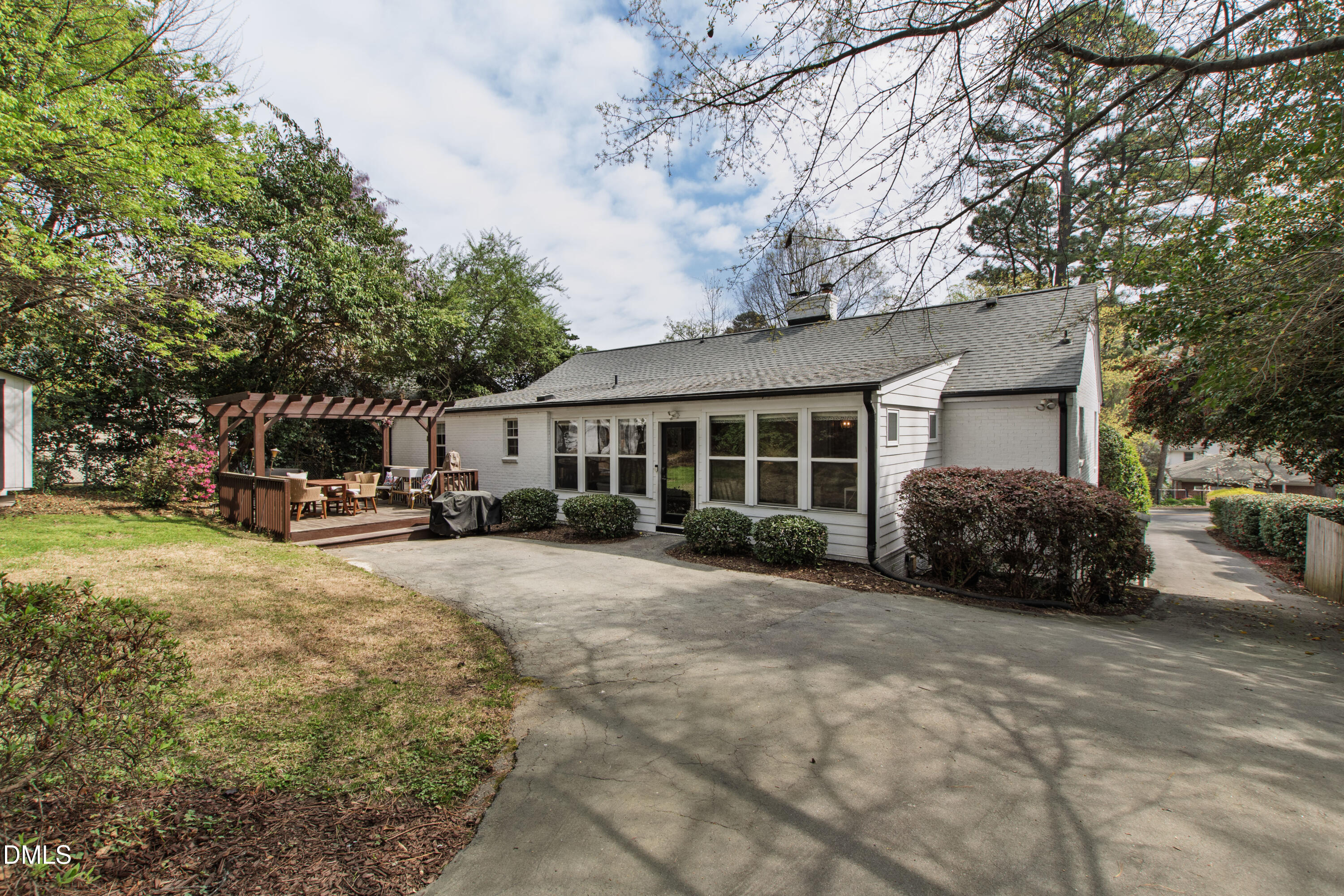 1205 Canterbury Road Raleigh, NC 27608 - Photo 44 of 48 a view of a house with a large tree in front of it