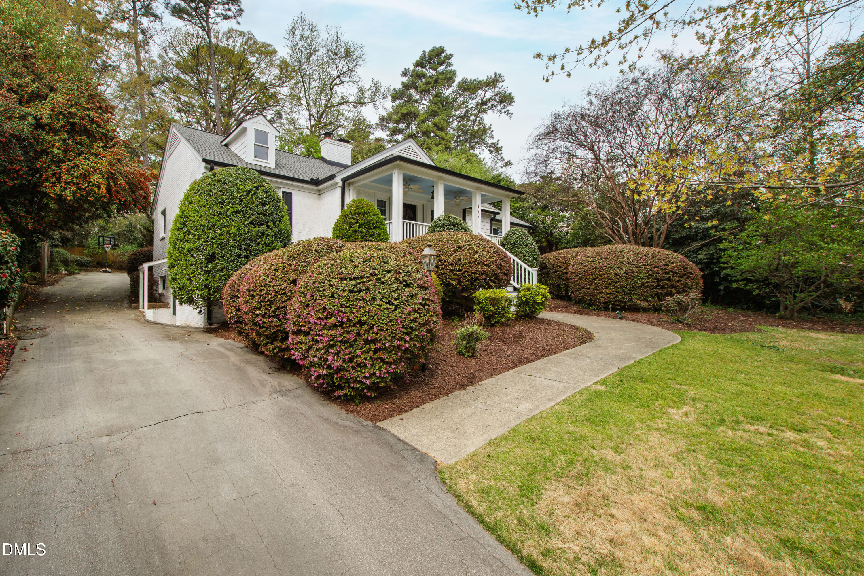 1205 Canterbury Road Raleigh, NC 27608 - Photo 4 of 48 a view of a house with a yard