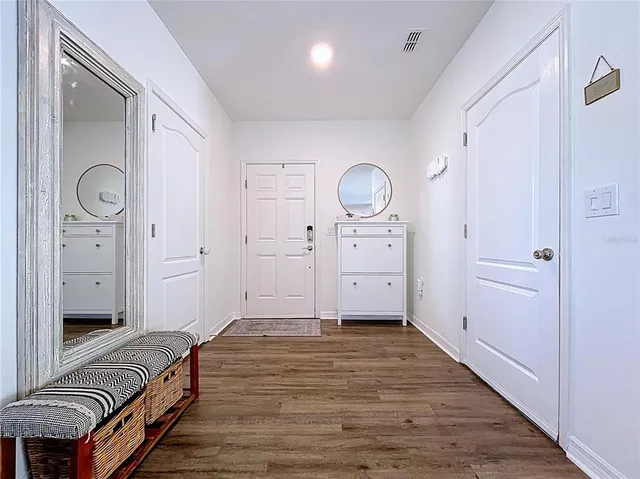 a kitchen with granite countertop a sink counter top space appliances and cabinets