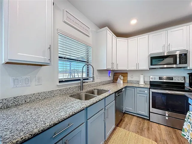 a spacious bathroom with a double vanity sink and a mirror