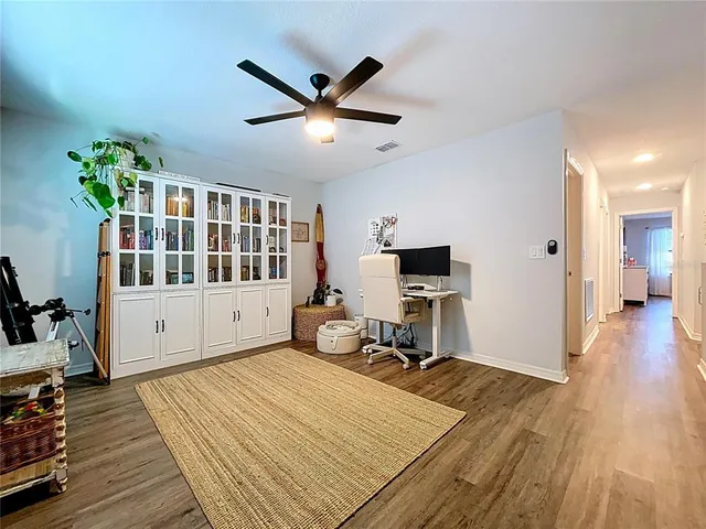 a spacious bedroom with a bed and a window