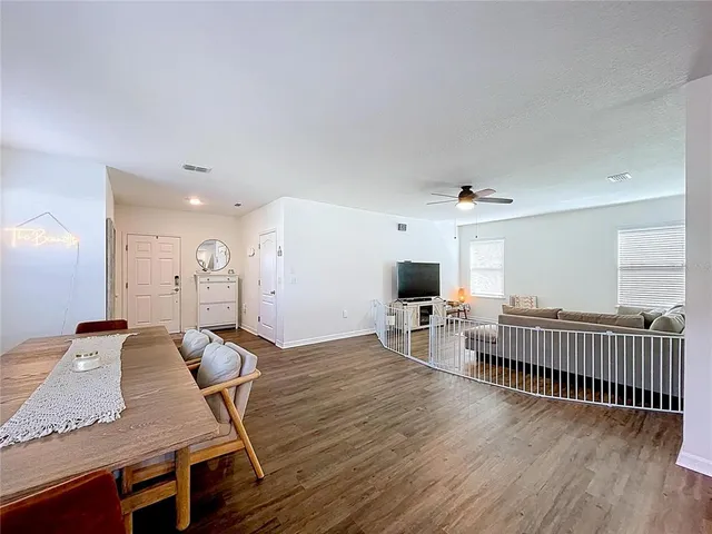 a view of a livingroom with furniture and wooden floor