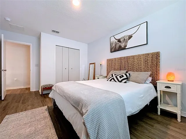 a bathroom with a double vanity sink mirror and shower