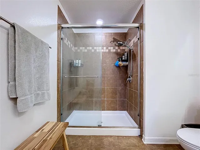 an aerial view of a house with swimming pool and outdoor space