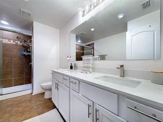 an aerial view of a house with a swimming pool yard and outdoor seating