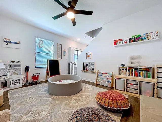 an aerial view of a house with a swimming pool yard and outdoor seating