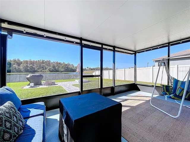 a view of a swimming pool and lounge chair