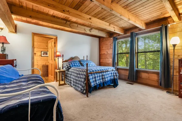 a bed room with a bed and a television