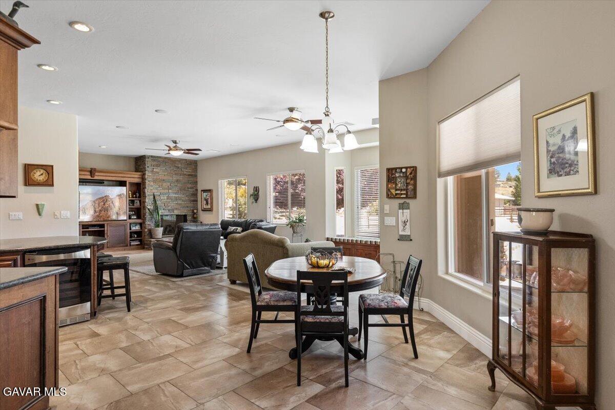23840 Martingale Way Tehachapi, CA 93561 - Photo 19 of 63 a view of a dining room with furniture and a chandelier