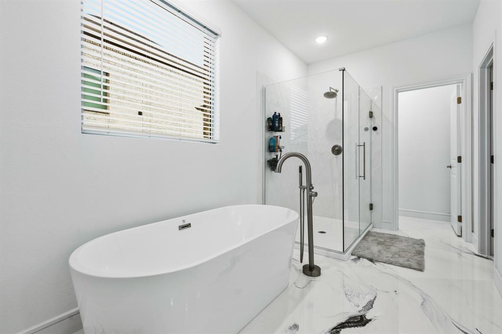 1926 Honey Crk Road Forney, TX 75126 - Photo 15 of 29 a white bath tub sitting in a bathroom