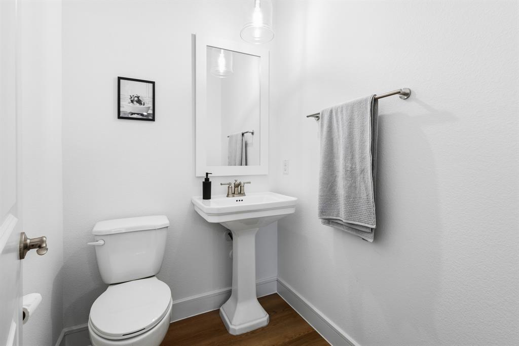 1926 Honey Crk Road Forney, TX 75126 - Photo 20 of 29 a bathroom with a toilet sink and mirror